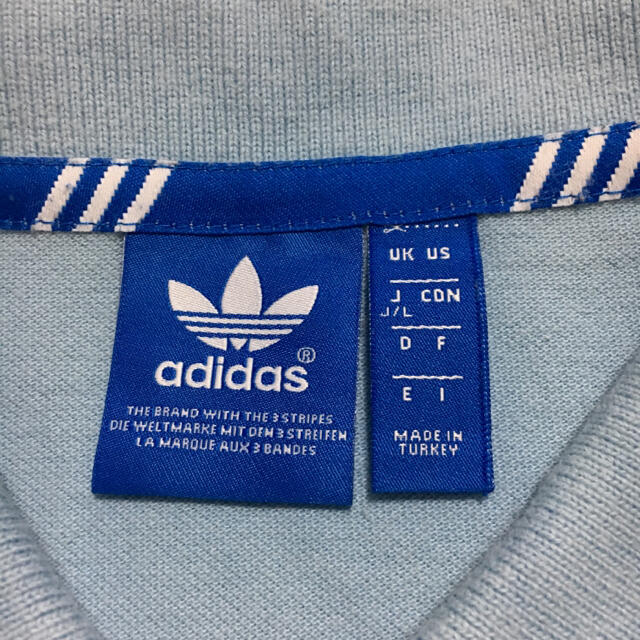 adidas(アディダス)のアディダスオリジナルス ロゴ ポロシャツ ブルー  Lサイズ メンズのトップス(Tシャツ/カットソー(半袖/袖なし))の商品写真