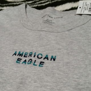 アメリカンイーグル(American Eagle)のAEタグ付き新品グレーMコットン100%アメリカンイーグルTシャツ男女兼用にも♪(Tシャツ/カットソー(半袖/袖なし))