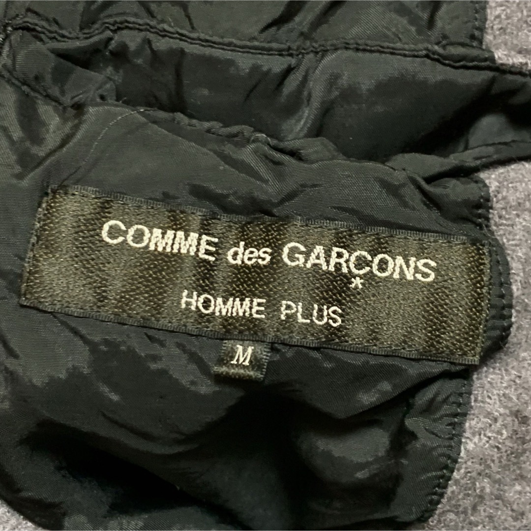 COMME des GARCONS HOMME PLUS(コムデギャルソンオムプリュス)のCOMME des GARCONS HOMME PLUS ノーカラー ジャケット メンズのジャケット/アウター(ノーカラージャケット)の商品写真