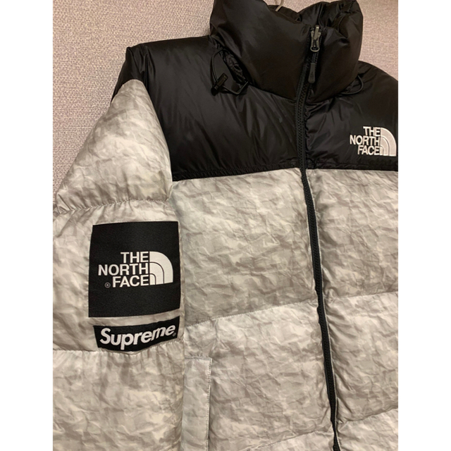 Supreme(シュプリーム)のsupreme Paper Print Nuptse メンズのジャケット/アウター(ダウンジャケット)の商品写真