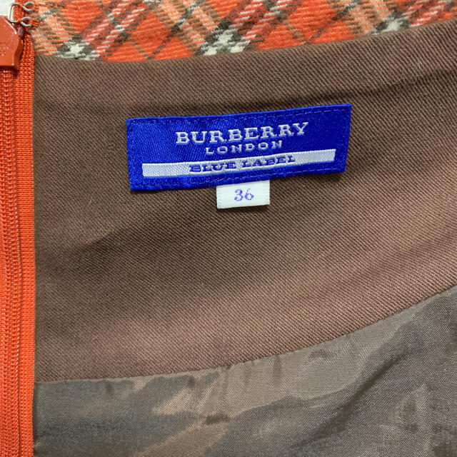 BURBERRY BLUE LABEL(バーバリーブルーレーベル)のバーバリー　ブルーレーベル　ミニスカート　オレンジ　ノバチェック レディースのスカート(ミニスカート)の商品写真