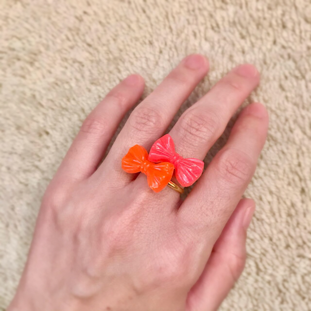 【kus kus】リボンリング 2つセット ピンク/オレンジ クスクス レディースのアクセサリー(リング(指輪))の商品写真