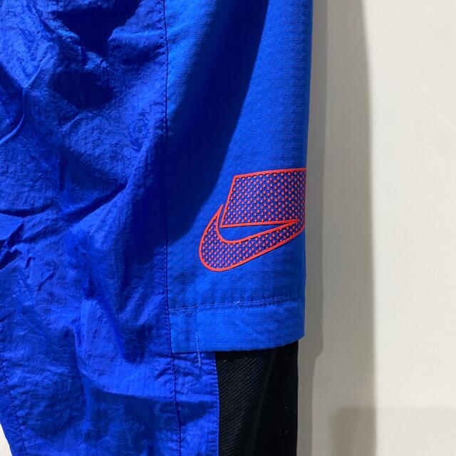 NIKE(ナイキ)のNIKE ナイロンパンツ　ブルーS メンズのトップス(ジャージ)の商品写真