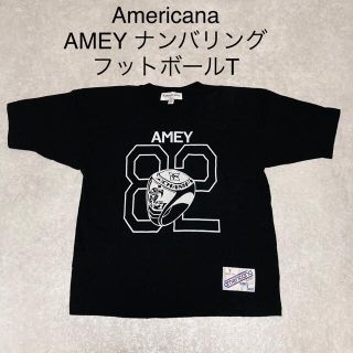 アメリカーナ(AMERICANA)のAmericana AMEY ロゴ フットボール ナンバリング Tシャツ 黒(Tシャツ(半袖/袖なし))