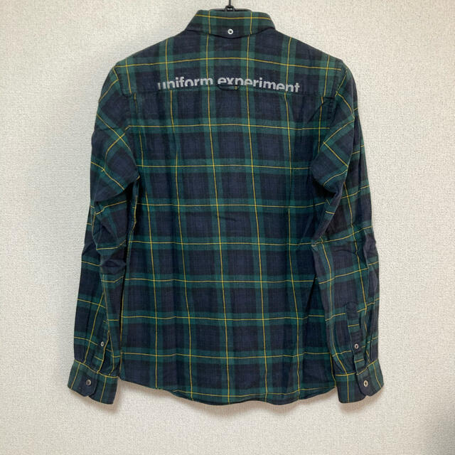 uniform experiment(ユニフォームエクスペリメント)のUE BACK PRINT FLANNEL CHECK B.D SHIRT メンズのトップス(シャツ)の商品写真