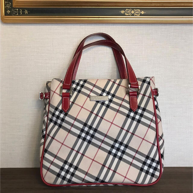 BURBERRY BLUE LABEL(バーバリーブルーレーベル)のバ一バリ一ブル一レ一ベル チェック柄ハンドバッグ ベージュ系×レッド レディースのバッグ(クラッチバッグ)の商品写真