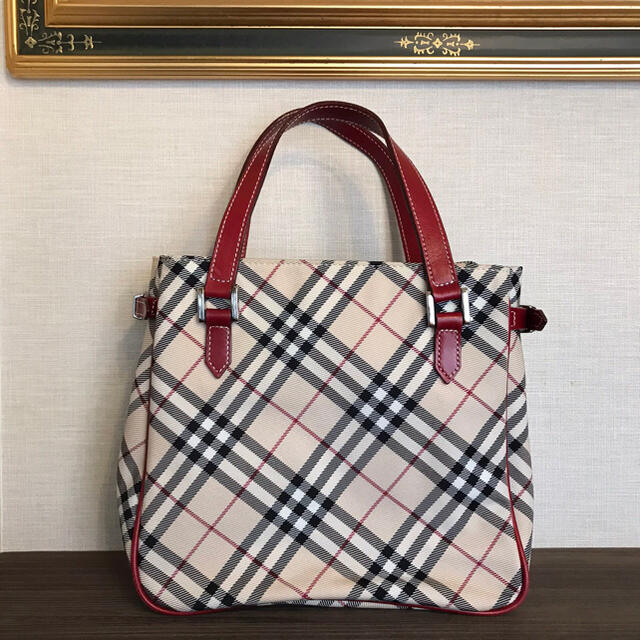 BURBERRY BLUE LABEL(バーバリーブルーレーベル)のバ一バリ一ブル一レ一ベル チェック柄ハンドバッグ ベージュ系×レッド レディースのバッグ(クラッチバッグ)の商品写真