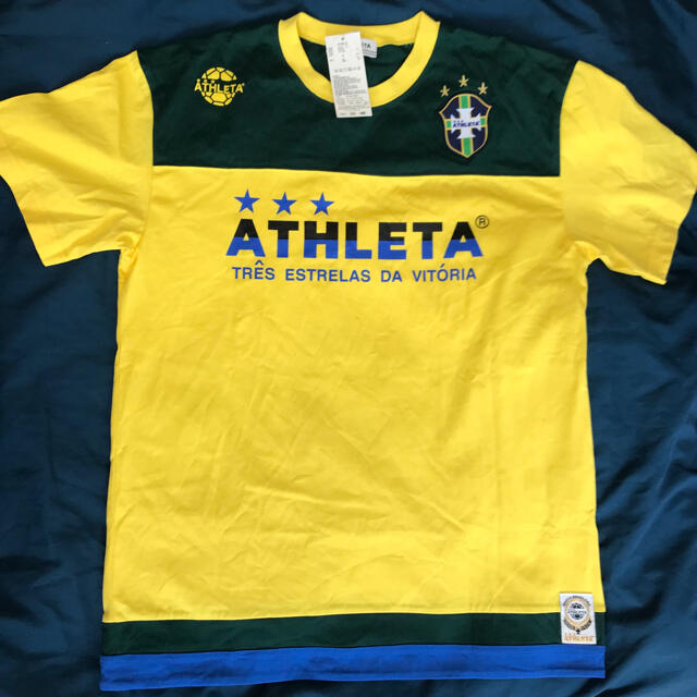 ATHLETA(アスレタ)の新品未使用　タグ付き　アスレタ　tシャツ   Ｌサイズ　サッカー　フットサル スポーツ/アウトドアのサッカー/フットサル(ウェア)の商品写真