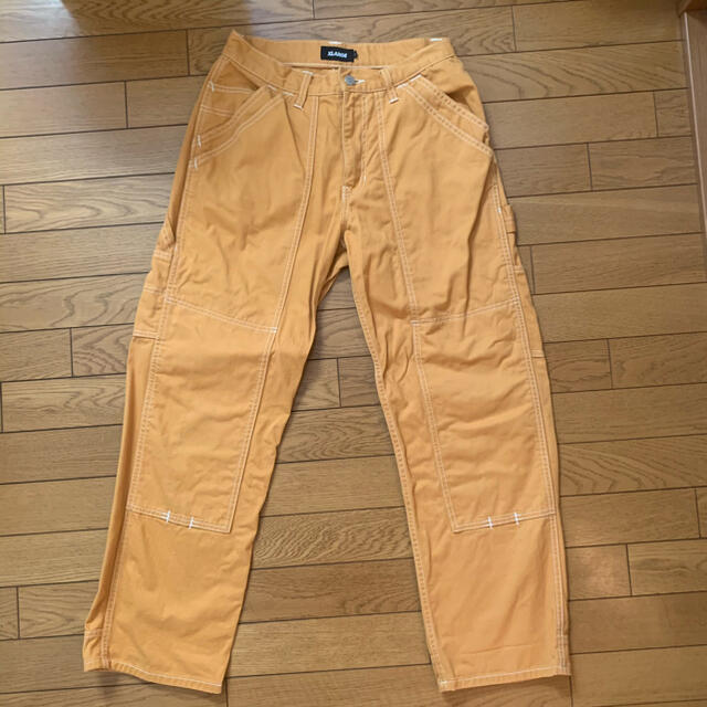 XLARGE(エクストララージ)のエクストララージ　STITCH PAINTER PANT(黄色) メンズのパンツ(ワークパンツ/カーゴパンツ)の商品写真