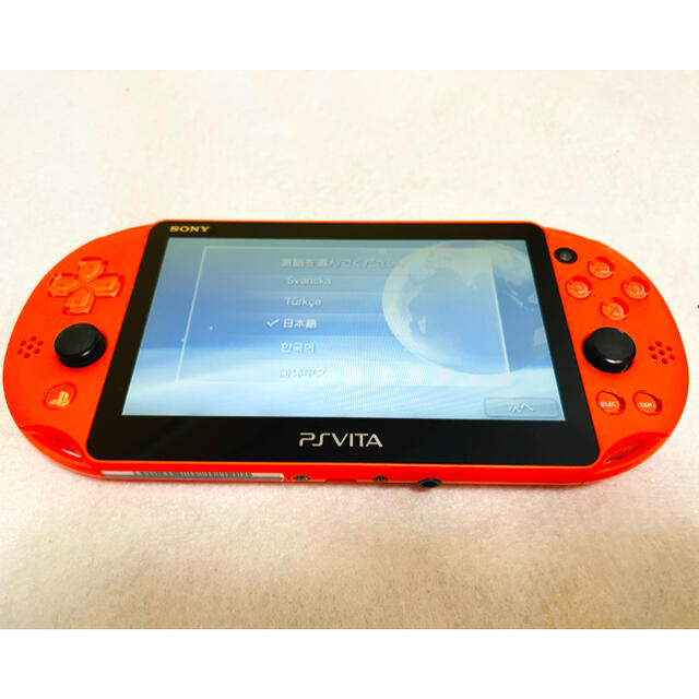 PlayStation Vita(プレイステーションヴィータ)のPSVita PCH-2000 ZA24 SONY  ネオンオレンジ 動作確認済 エンタメ/ホビーのゲームソフト/ゲーム機本体(家庭用ゲーム機本体)の商品写真