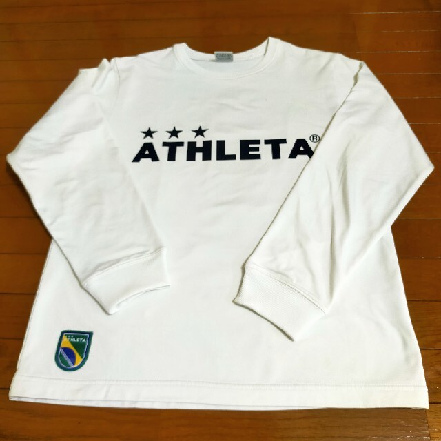 ATHLETA(アスレタ)の送料込み☆中古☆ATHLETA☆アスレタ☆長袖Tシャツ☆M スポーツ/アウトドアのサッカー/フットサル(ウェア)の商品写真