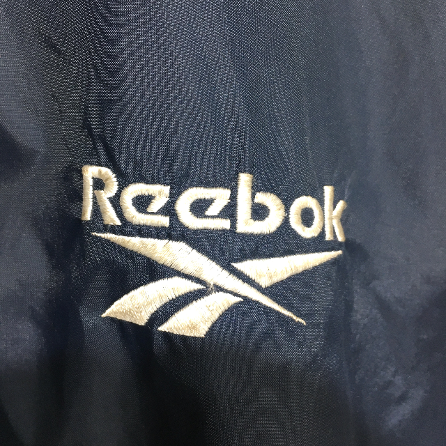 Reebok(リーボック)の〇。リーボック　ナイロンジャケット　XL　ネイビー　ロゴ刺繍　K12。〇 メンズのジャケット/アウター(ナイロンジャケット)の商品写真