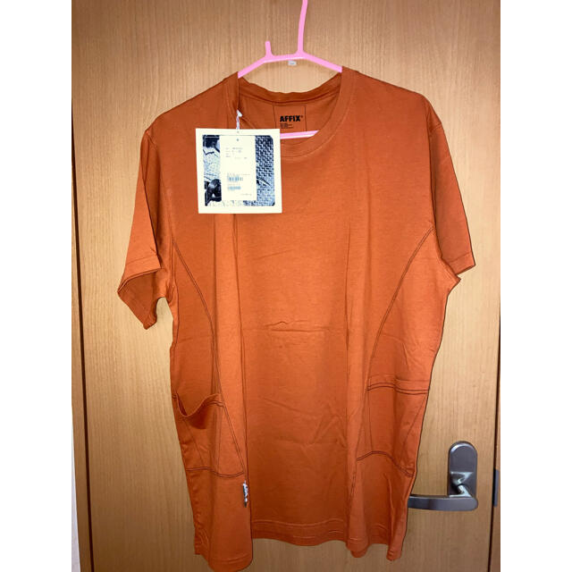 carhartt(カーハート)の新品　AFFIX ポケットTシャツ　オレンジ　XL メンズのトップス(Tシャツ/カットソー(半袖/袖なし))の商品写真