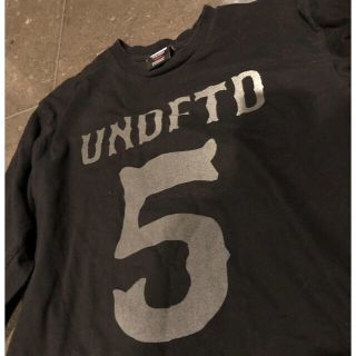 アンディフィーテッド(UNDEFEATED)のUNDEFEATED リフレクターロゴ　ロンT Mサイズ(Tシャツ/カットソー(七分/長袖))