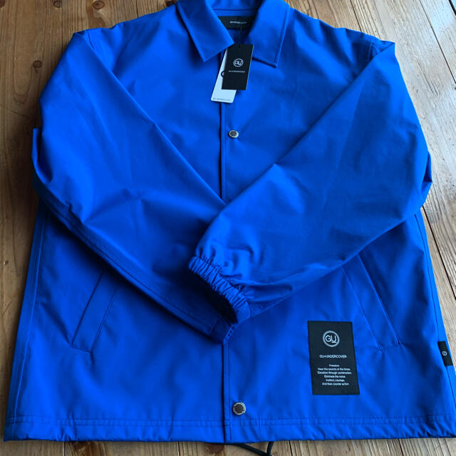 GU(ジーユー)のコーチジャケット　UNDERCOVER ブルー　Sサイズ メンズのジャケット/アウター(ナイロンジャケット)の商品写真