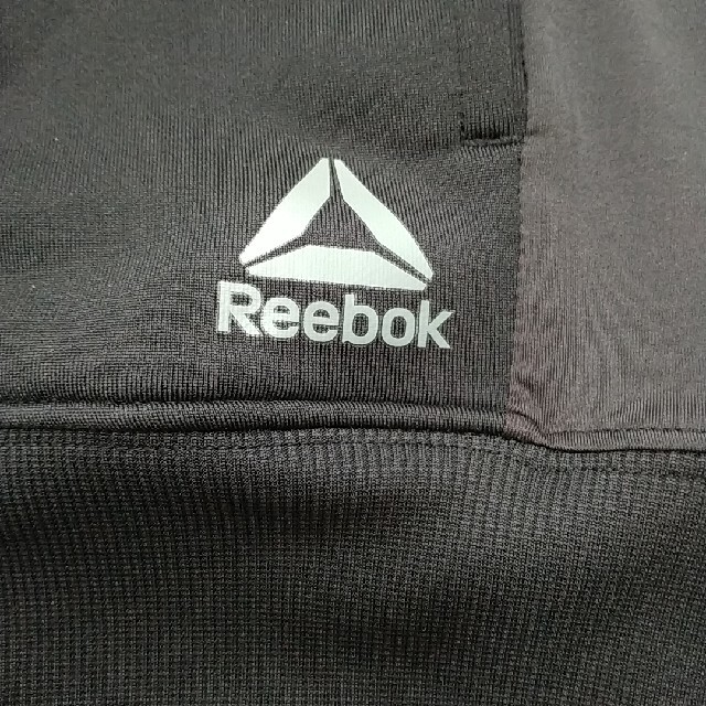 Reebok(リーボック)のREEBOK 黒×グレー迷彩　パーカー スポーツ/アウトドアのトレーニング/エクササイズ(ウォーキング)の商品写真