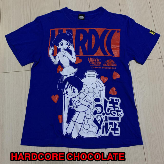 HARDCORE CHOCOLATE(ハードコアチョコレート)のHARDCC × 手塚治虫 [ふしぎなメルモ]Tシャツ メンズのトップス(Tシャツ/カットソー(半袖/袖なし))の商品写真