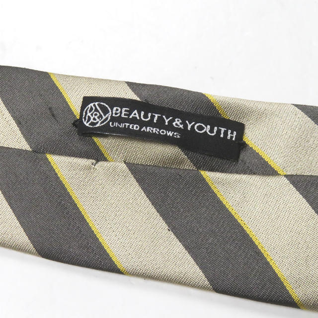 BEAUTY&YOUTH UNITED ARROWS(ビューティアンドユースユナイテッドアローズ)のBEAUTY&YOUTH UNITED ARROWS ビューティーアンドユース ユナイテッドアローズ イタリア製 ダメージ加工 シルクレジメンタルナローネクタイ ベージュ【中古】【BEAUTY&YOUTH UNITED ARROWS】 メンズのファッション小物(ネクタイ)の商品写真