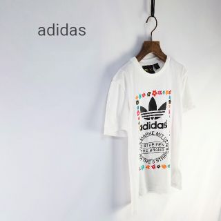 アディダス(adidas)のadidas × PHARRELL WILLIAMS コラボ フラワーＴシャツ(Tシャツ(半袖/袖なし))