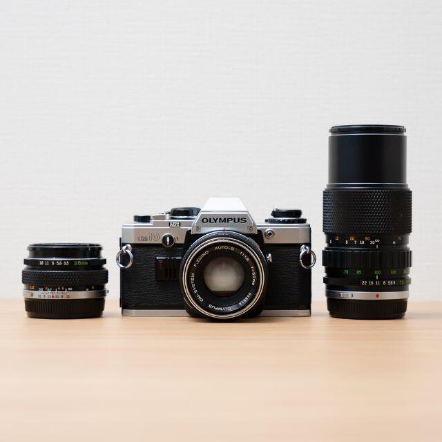 OLYMPUS(オリンパス)のOLYMPUS オリンパス OM10 レンズ3本/28mm 50mm 135mm スマホ/家電/カメラのカメラ(フィルムカメラ)の商品写真