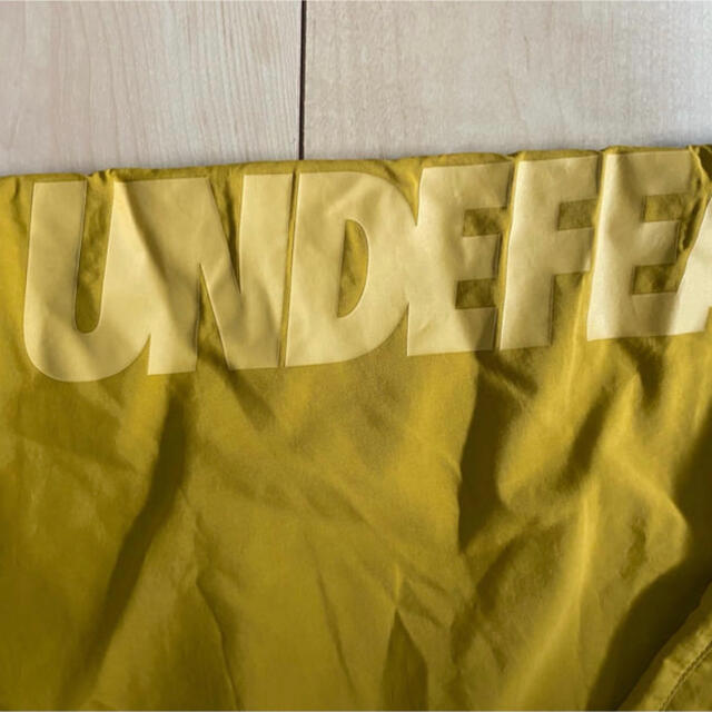 UNDEFEATED(アンディフィーテッド)のundefeated × champion nylon pants XL 新品 メンズのパンツ(その他)の商品写真