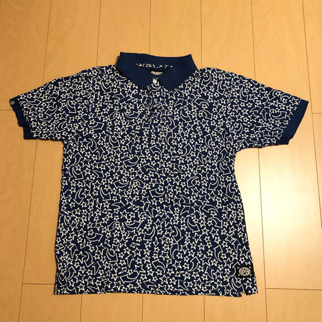 STUSSY(ステューシー)の【値下げ】STUSSY ステューシー　総柄星柄Tシャツ　ブルー　ポロシャツ メンズのトップス(ポロシャツ)の商品写真