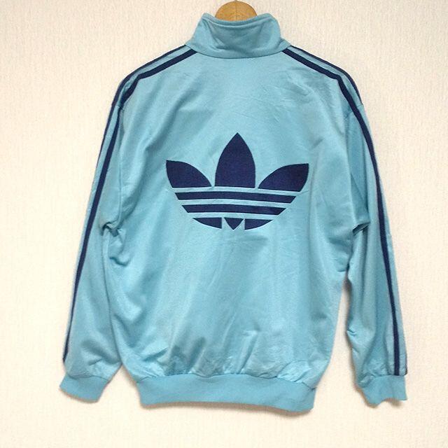 adidas(アディダス)のアディダスオリジナルス　ジャージ　Lスカイブルー　90s　万国旗タグ レディースのジャケット/アウター(ナイロンジャケット)の商品写真