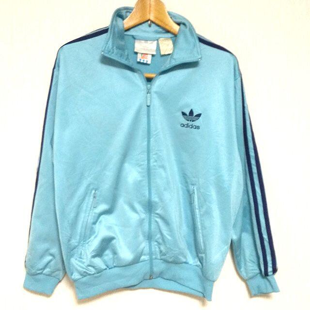 adidas(アディダス)のアディダスオリジナルス　ジャージ　Lスカイブルー　90s　万国旗タグ レディースのジャケット/アウター(ナイロンジャケット)の商品写真