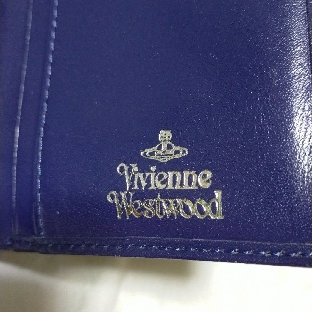 Vivienne Westwood(ヴィヴィアンウエストウッド)のヴィヴィアンウエストウッド　２つ折り財布　パープル　イタリア製　　レザー レディースのファッション小物(財布)の商品写真