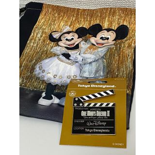 ディズニー(Disney)の【新品未使用】ワンマンズドリーム　巾着＆ピンバッジセット(キャラクターグッズ)