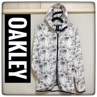 オークリー(Oakley)の【美品】OAKLEY(オークリー)★総柄薄手パーカー★白×黒XLサイズ★(パーカー)