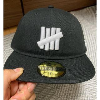 アンディフィーテッド(UNDEFEATED)のUNDEFEATED × New Era 19TWENTY 7 3/8 黒(キャップ)