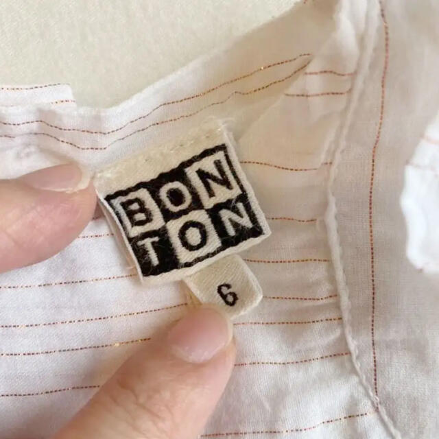 Bonpoint(ボンポワン)のEri様Bonton 白・ゴールドラメライン入りロンパース キッズ/ベビー/マタニティのベビー服(~85cm)(ロンパース)の商品写真