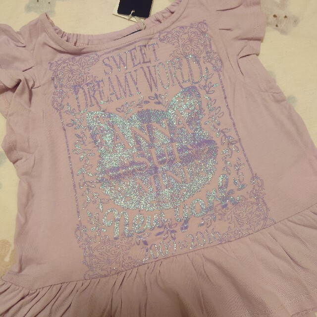 ANNA SUI mini(アナスイミニ)の新品　アナスイミニ　ラメねこフリルトップス　110cm キッズ/ベビー/マタニティのキッズ服女の子用(90cm~)(Tシャツ/カットソー)の商品写真