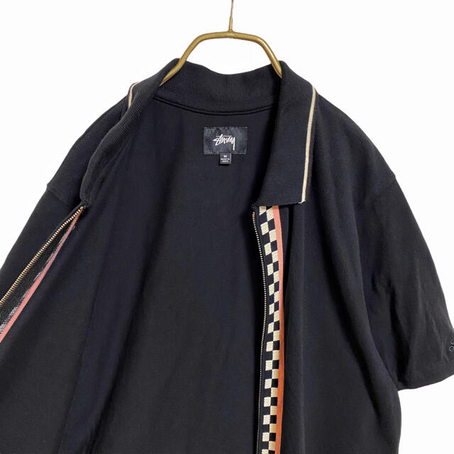 STUSSY(ステューシー)の【廃盤】ステューシー チェッカーフラッグ ジップ ポロシャツ メンズ M 黒 メンズのトップス(ポロシャツ)の商品写真