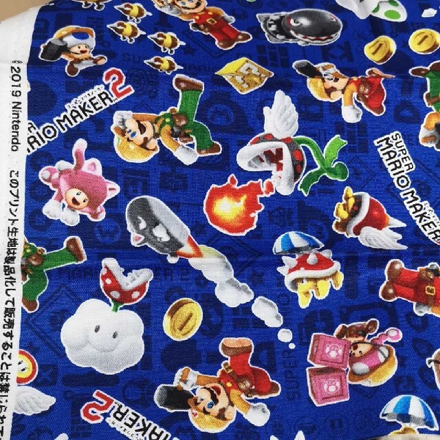 マリオメーカー2 生地 スーパーマリオ ロゴ ブルー はぎれ 55×25 ハンドメイドの素材/材料(生地/糸)の商品写真