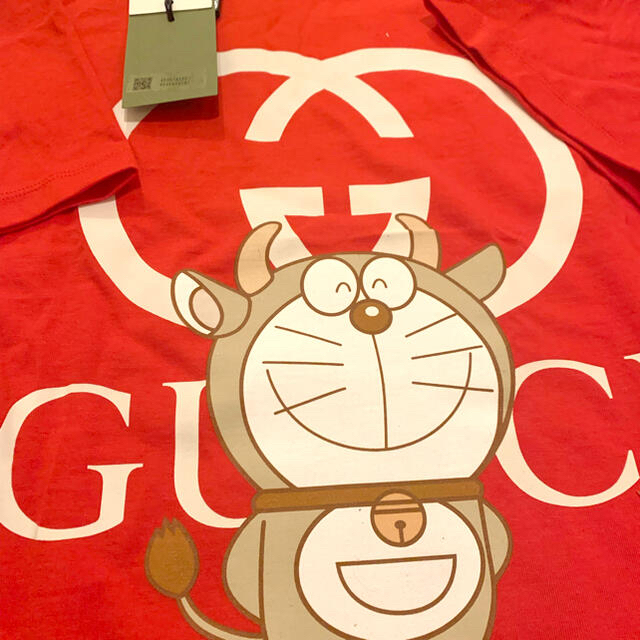 Gucci(グッチ)の【希少】グッチ　ドラえもん　コラボ　牛柄Ｔシャツ レディースのトップス(Tシャツ(半袖/袖なし))の商品写真