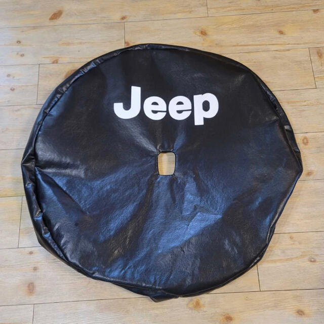 Jeep(ジープ)のJL ラングラー スペアタイヤ　JEEP ジープ　カバー　新車外し　新品 自動車/バイクの自動車(車種別パーツ)の商品写真