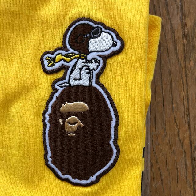 A BATHING APE(アベイシングエイプ)のBAPE KIDS × SNOOPY Tシャツ　120 キッズ/ベビー/マタニティのキッズ服男の子用(90cm~)(Tシャツ/カットソー)の商品写真