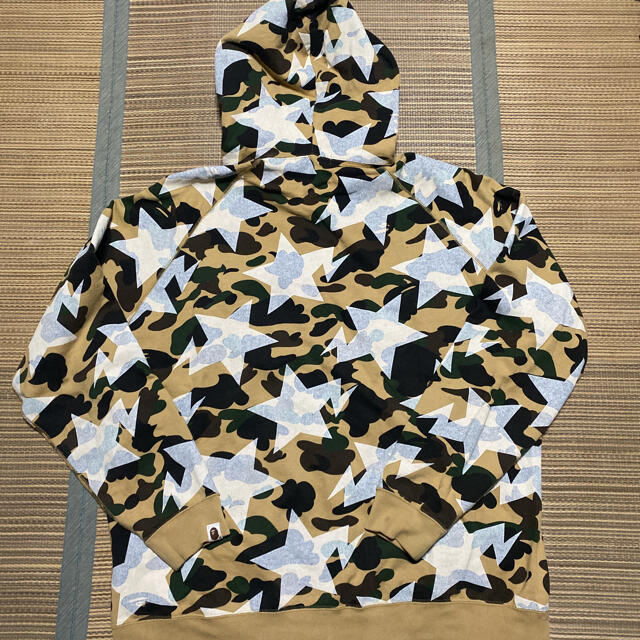 A BATHING APE(アベイシングエイプ)のAPE BAPE KAWS 1st camo 迷彩　パーカー　sta XL メンズのトップス(パーカー)の商品写真