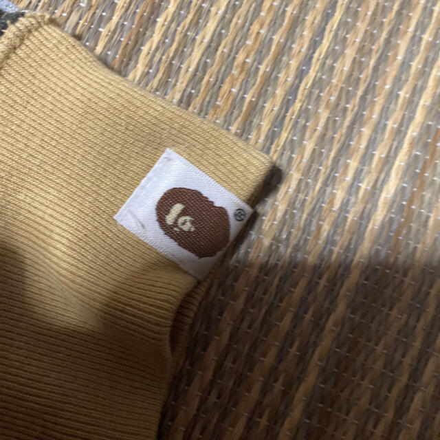 A BATHING APE(アベイシングエイプ)のAPE BAPE KAWS 1st camo 迷彩　パーカー　sta XL メンズのトップス(パーカー)の商品写真