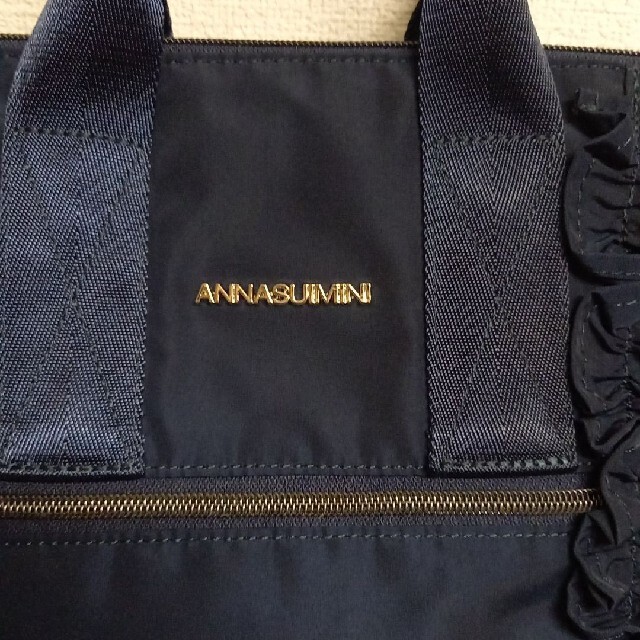 ANNA SUI mini(アナスイミニ)の今期　ANNA SUI mini　フリルマザーズリュック　ネイビー　今期　美品 キッズ/ベビー/マタニティのマタニティ(マザーズバッグ)の商品写真