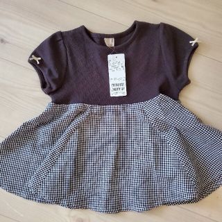 プティマイン(petit main)のpetit main総柄ドッキングペプラムTシャツ(Tシャツ/カットソー)