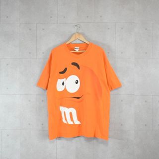 エムアンドエムアンドエムズ(m&m&m's)のM&M’s オレンジTシャツ　ビックプリント　オーバーサイズ　公式　古着(Tシャツ/カットソー(半袖/袖なし))