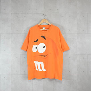 エムアンドエムアンドエムズ(m&m&m's)のM&M’s オレンジTシャツ　ビックプリント　オーバーサイズ　公式　古着(Tシャツ/カットソー(半袖/袖なし))
