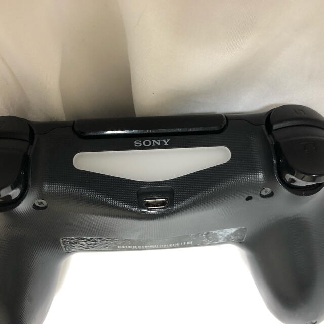 PlayStation4(プレイステーション4)の【完動品】DUALSHOCK4 ジェットブラック　中古美品 エンタメ/ホビーのゲームソフト/ゲーム機本体(家庭用ゲーム機本体)の商品写真