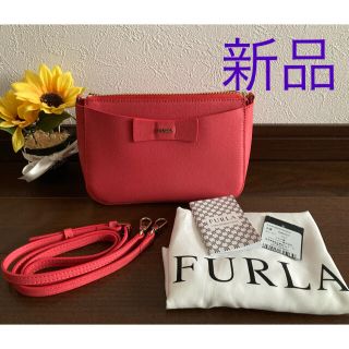 フルラ(Furla)の【新品】フルラミニクロスリボンボディバッグ(サーモンピンク)(ショルダーバッグ)