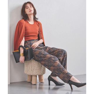 ユナイテッドアローズ(UNITED ARROWS)のUNITED ARROWS★プリント ワイド パンツ 40オレンジ 試着のみ(カジュアルパンツ)