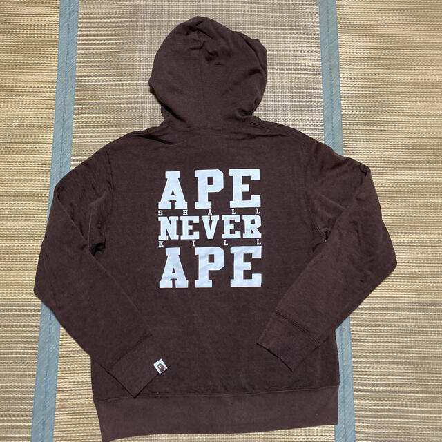 A BATHING APE(アベイシングエイプ)のAPE BAPE KAWS ハーフジップ　パーカー　never shall m メンズのトップス(パーカー)の商品写真