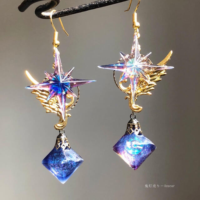 シリウスの羽根紋章と蓄光するフローライト宇宙レジンの魔法使いピアス